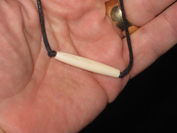 Buffalo bone hand carved piping pendant, with adjustable necklace.