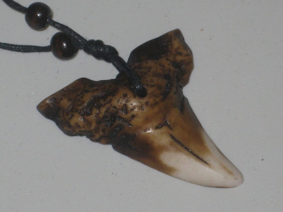 Surfers killer shark tooth necklace, adjustable up to 32" long.