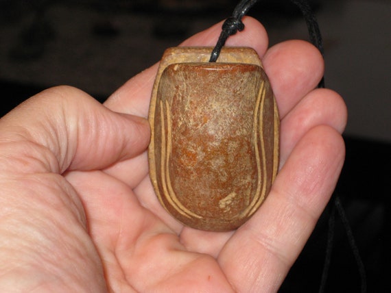 Hand carved stone turtle shell pendant with adjustable necklace.