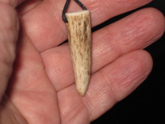 All natural deer antler tip, with adjustable necklace.