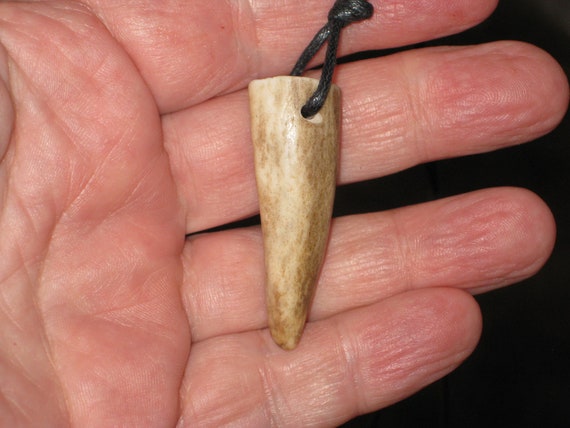 All natural deer antler tip, with adjustable necklace.