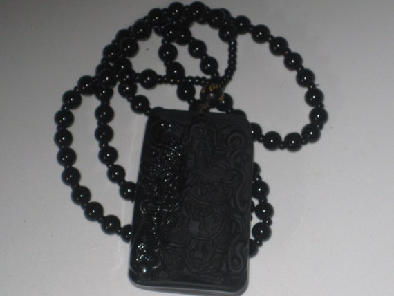 Hand carved black Obsidian Guan Yu pendant, with glass bead necklace.