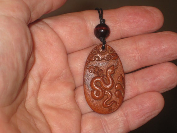 Hand carved Chinese Zodiac sign rosewood necklace (Snake), 24" long.