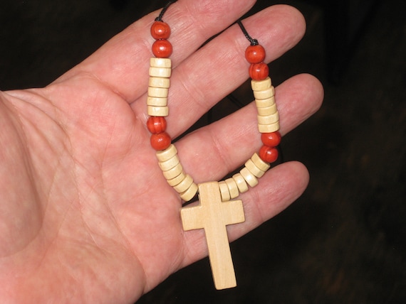 Hand carved wood cross pendant, with adjustable necklace.