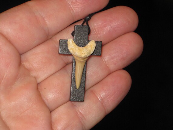 Hand carved wood cross and fossil shark tooth from Morocco, with adjustable necklace.