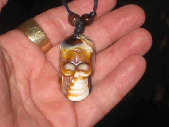 Surfers Butterscotch skull necklace, adjustable up to 32" long.