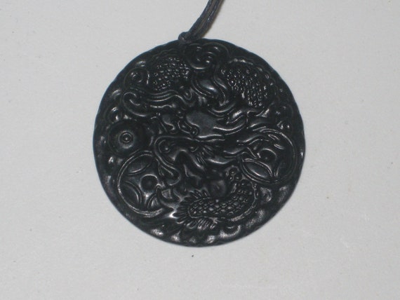 Hand carved black and green jade dragon pendant, with adjustable necklace.