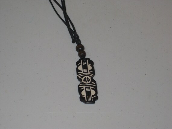 Hand carved primitive African design pendant, Buffalo bone.