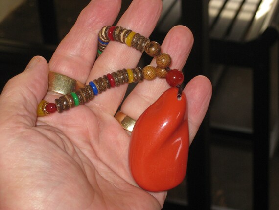 Hand carved Sandalwood pendant with stone beads and pendant.