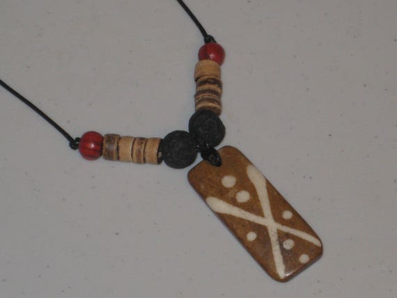 Hand carved primitive African design pendant, Buffalo bone.