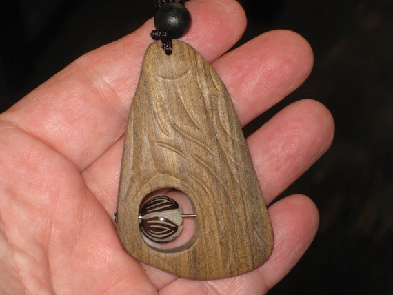 Hand carved Sandalwood pendant, with adjustable necklace.
