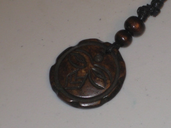Hand carved primitive African design pendant, Buffalo bone.