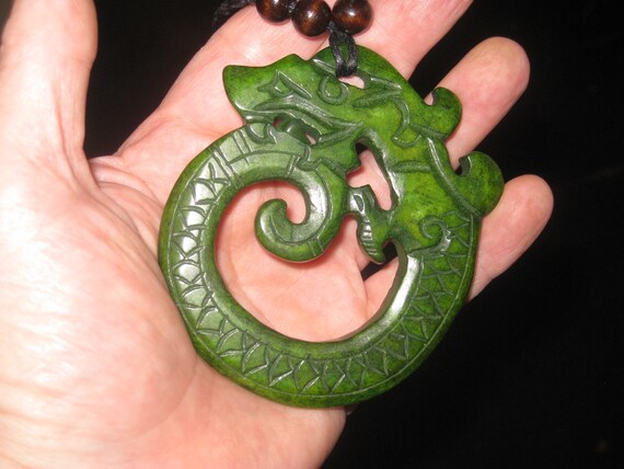 All natural hand carved two sided very old Jade dragon pendant, with adjustable necklace.