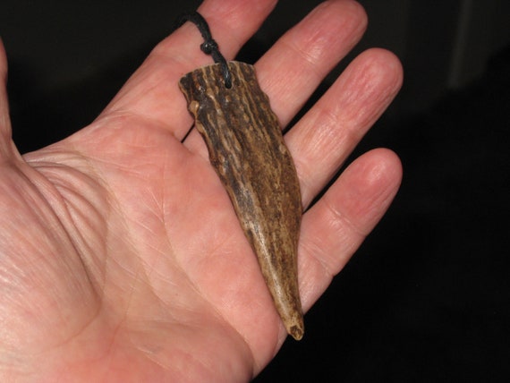 All natural deer antler tip, with adjustable necklace.