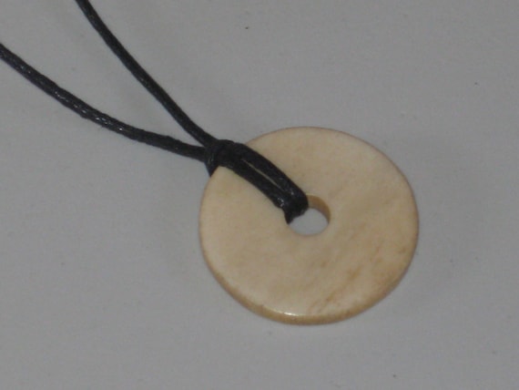 Hand carved bone pendant, with adjustable necklace.