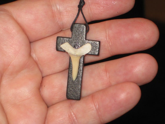 Hand carved wood cross and fossil shark tooth from Morocco, with adjustable necklace.