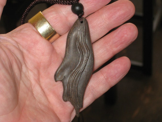 Hand carved Sandalwood pendant, with adjustable necklace.