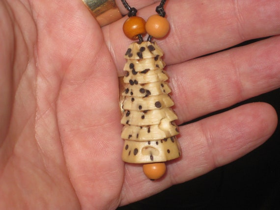 Hand carved Bodhi seed pendant with wood beads.
