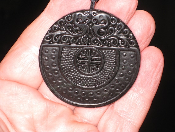 All natural hand carved very old black Jade dragon pendant.