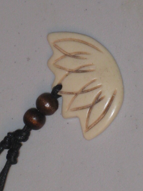 Hand carved Buffalo bone flower.