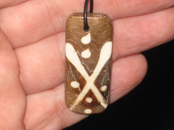 Buffalo bone African tribal, hand carved pendant.