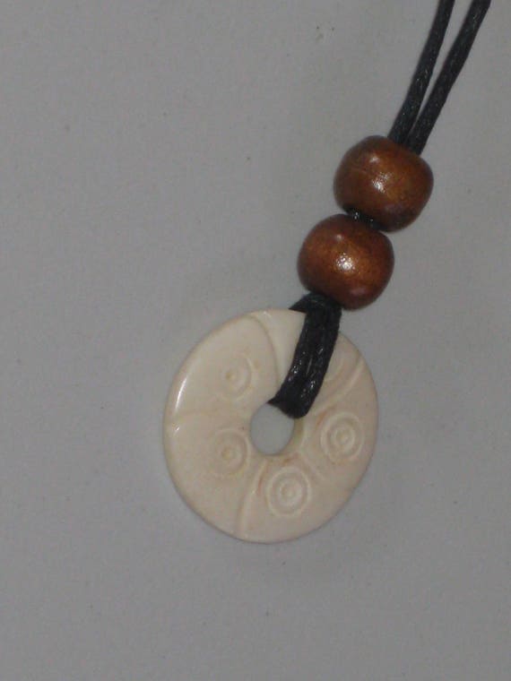 Hand carved bone pendant, with adjustable necklace.