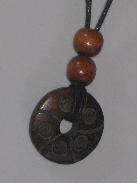 Hand carved bone pendant, with adjustable necklace.