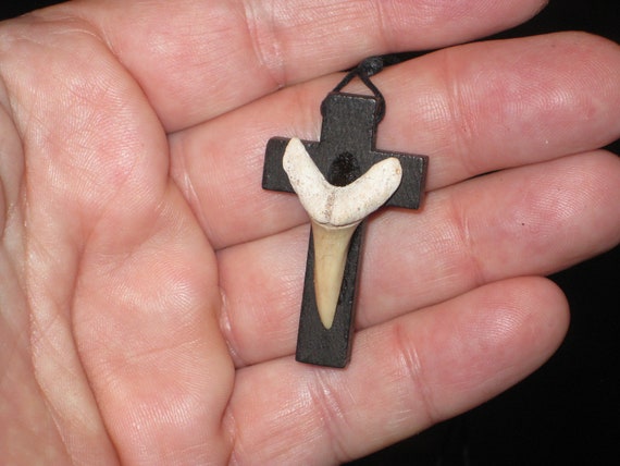 Hand carved wood cross and fossil shark tooth from Morocco, with adjustable necklace.
