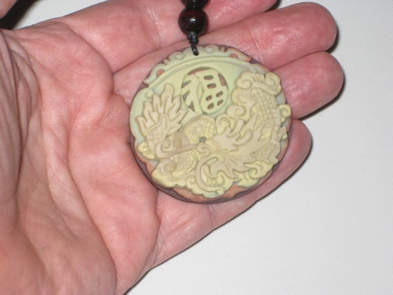 All natural hand carved Jade stone dragon pendant, with adjustable necklace.