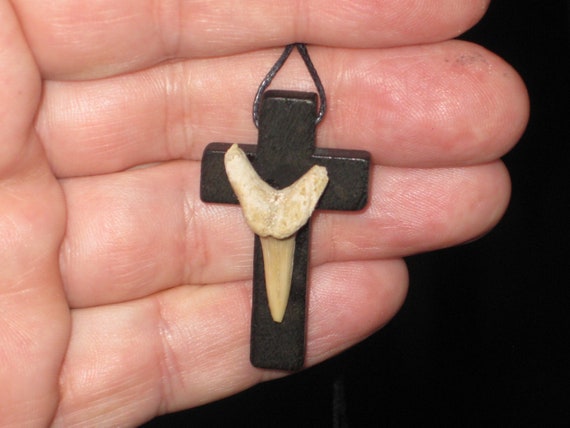 Hand carved cross and fossil shark tooth from Morocco, with adjustable necklace.