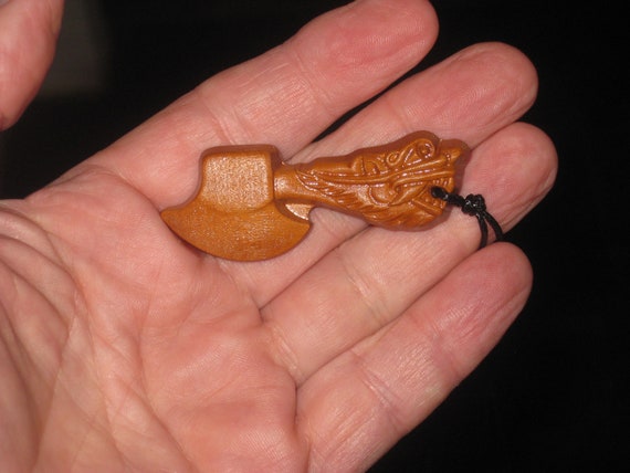 Hand carved rosewood dragon axe pendant.