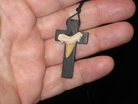Hand carved wood cross and fossil shark tooth from Morocco, with adjustable necklace.