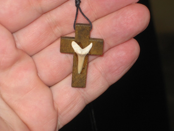 Hand carved wood cross with fossil shark tooth from Morocco, with adjustable necklace.