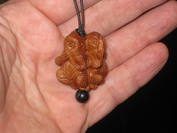 Hand carved rosewood necklace, see no evil, hear no evil, speak no evil.
