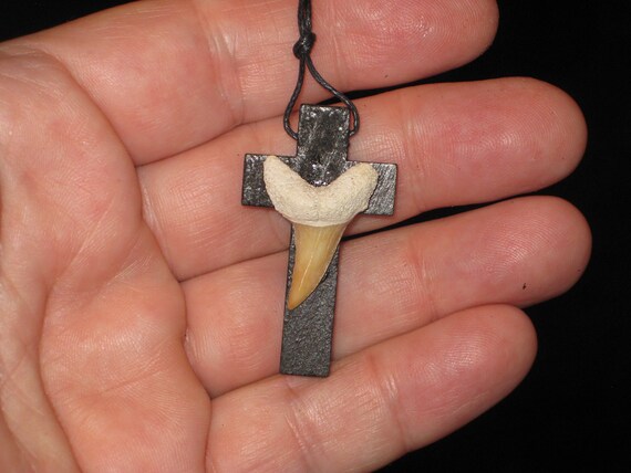 Hand carved wood cross and fossil shark tooth from Morocco, with adjustable necklace.