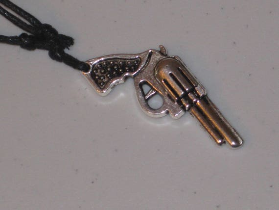 Six shooter gun pendant, hand made.