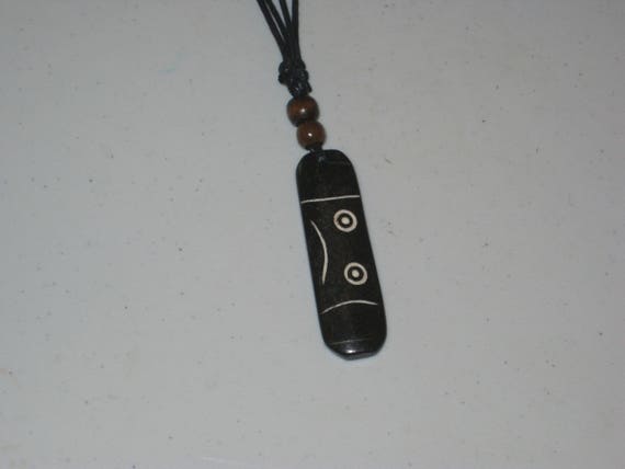 Hand carved primitive African design pendant, Buffalo bone.