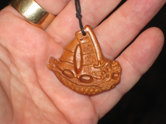 Hand carved Rosewood dragon boat pendant necklace.