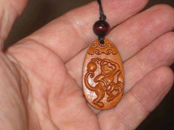 Hand carved Chinese Zodiac sign rosewood necklace (Monkey), 24" long.