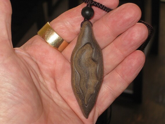 Hand carved Sandalwood pendant, with adjustable necklace.