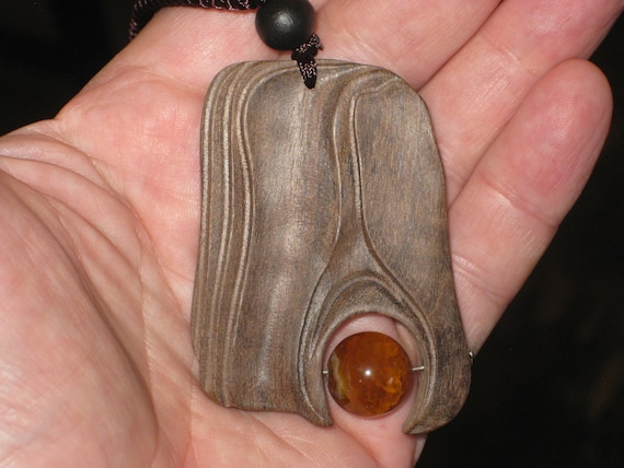 Hand carved Sandalwood pendant, with adjustable necklace.