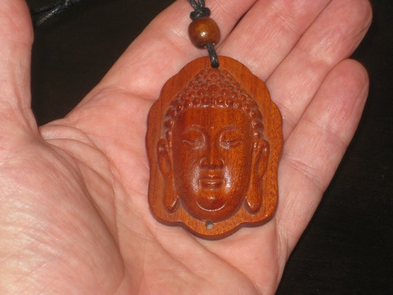 Hand carved rosewood pendant with wood beads.