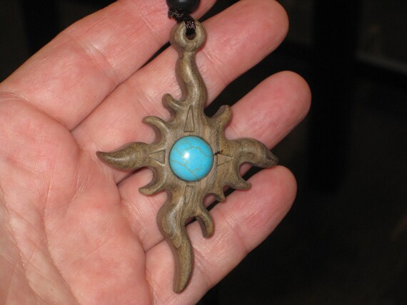 Hand carved Sandalwood pendant, with adjustable necklace.