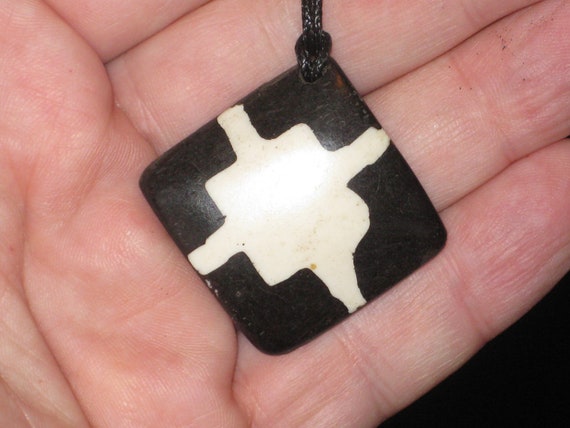 Buffalo bone African tribal, hand carved pendant.