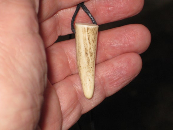 All natural deer antler tip, with adjustable necklace.