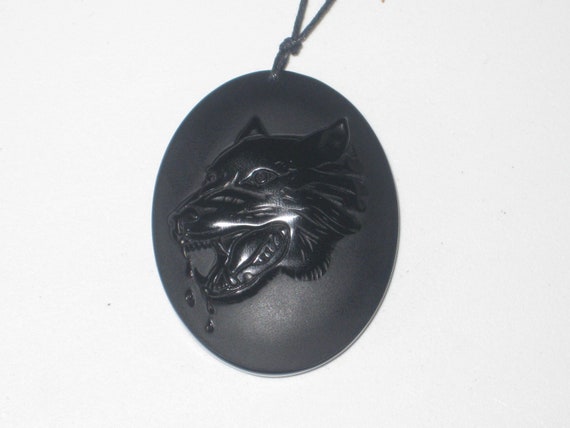 Hand carved black Obsidian wolf pendant, with adjustable necklace.