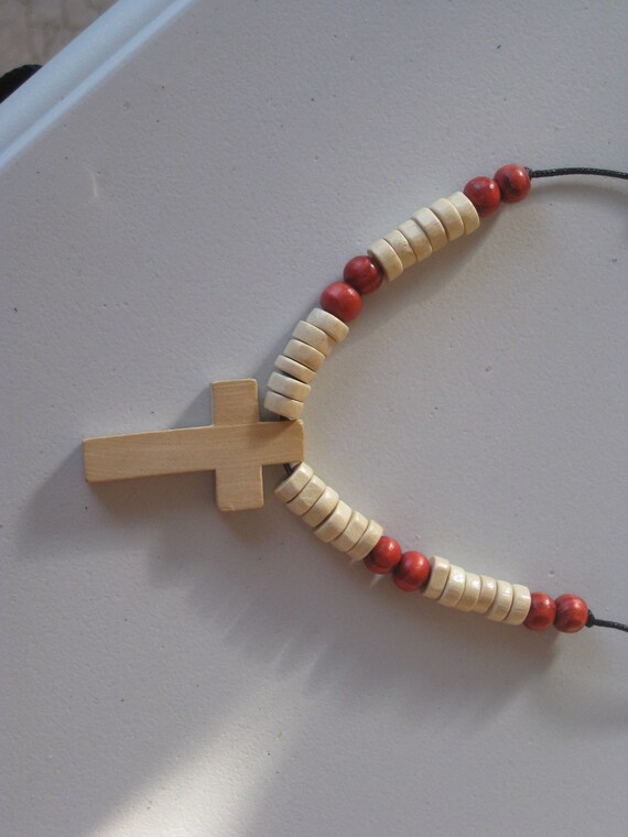 Hand carved wood cross pendant and wood beads from Africa.
