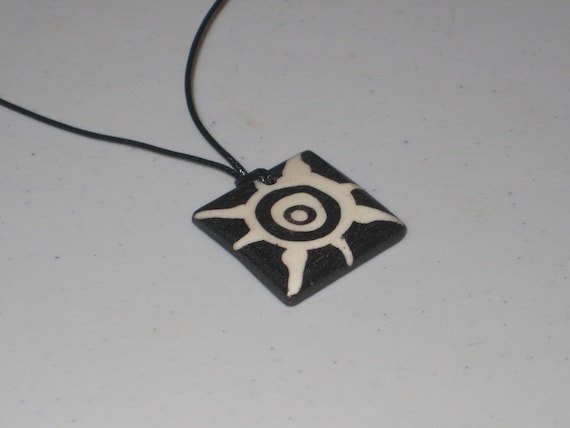 Hand carved primitive African design pendant, Buffalo bone.