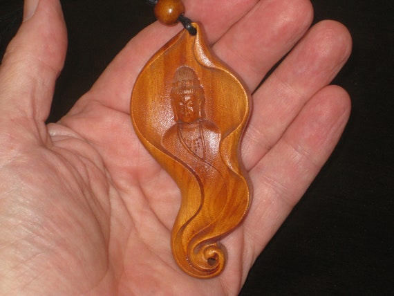 Hand carved rosewood pendant with wood beads.