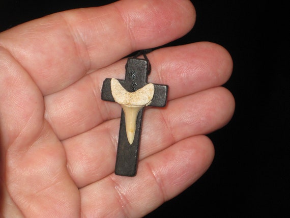 Hand carved wood cross and fossil shark tooth from Morocco, with adjustable necklace.